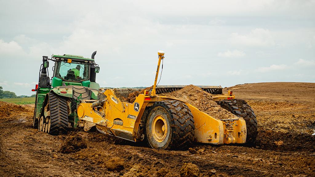 Efficient Topsoil Stripping with Deere Pull Pans Efficient Topsoil Stripping with Deere Pull Pans